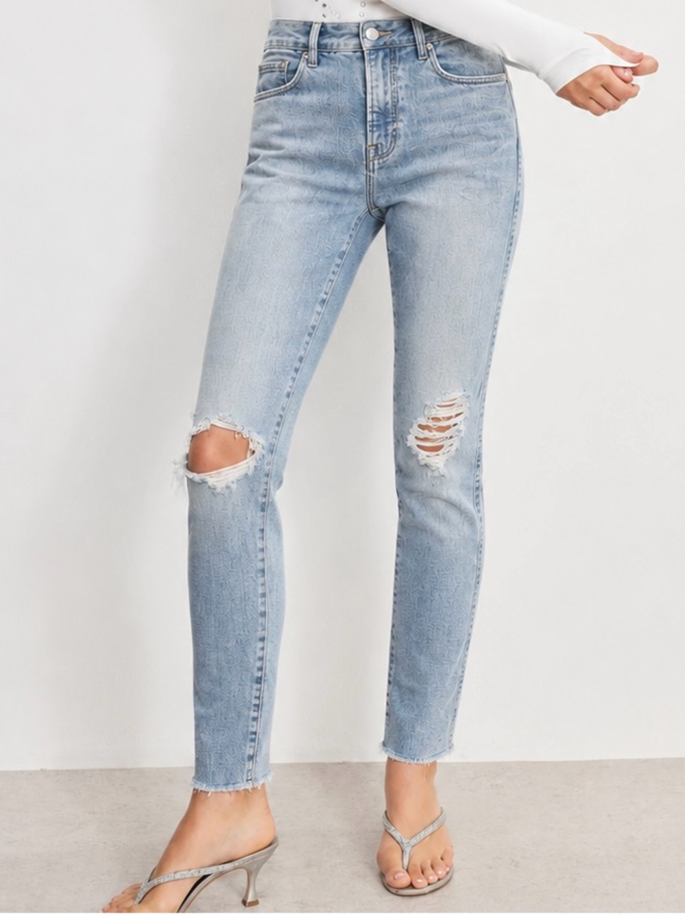 Good American light wash distressed ripped jeans